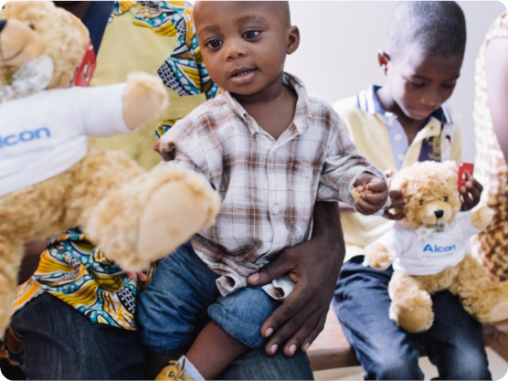 Young boy receiving a teddy bear