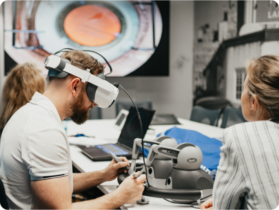 a man working with a vr headset on