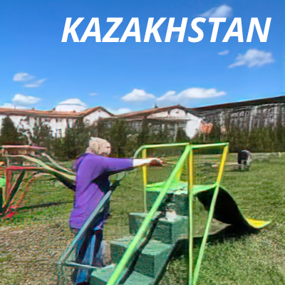 An Alcon volunteer in Kazakhstan cleaning playground equipment