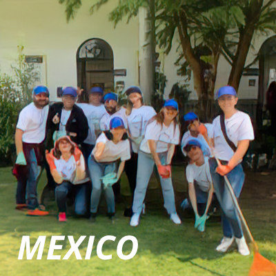 A group Alcon volunteers posing for a portrait after doing landscaping work in Mexico